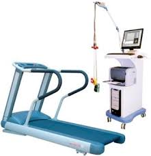 Medical rehabilitation treadmill with overhand bars and a mobile computer cart with monitor, for physical therapy exercises.