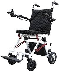 Compact electric wheelchair with a white frame, black seat, and four wheels featuring a high-back mesh seat and joystick control on the armrest.