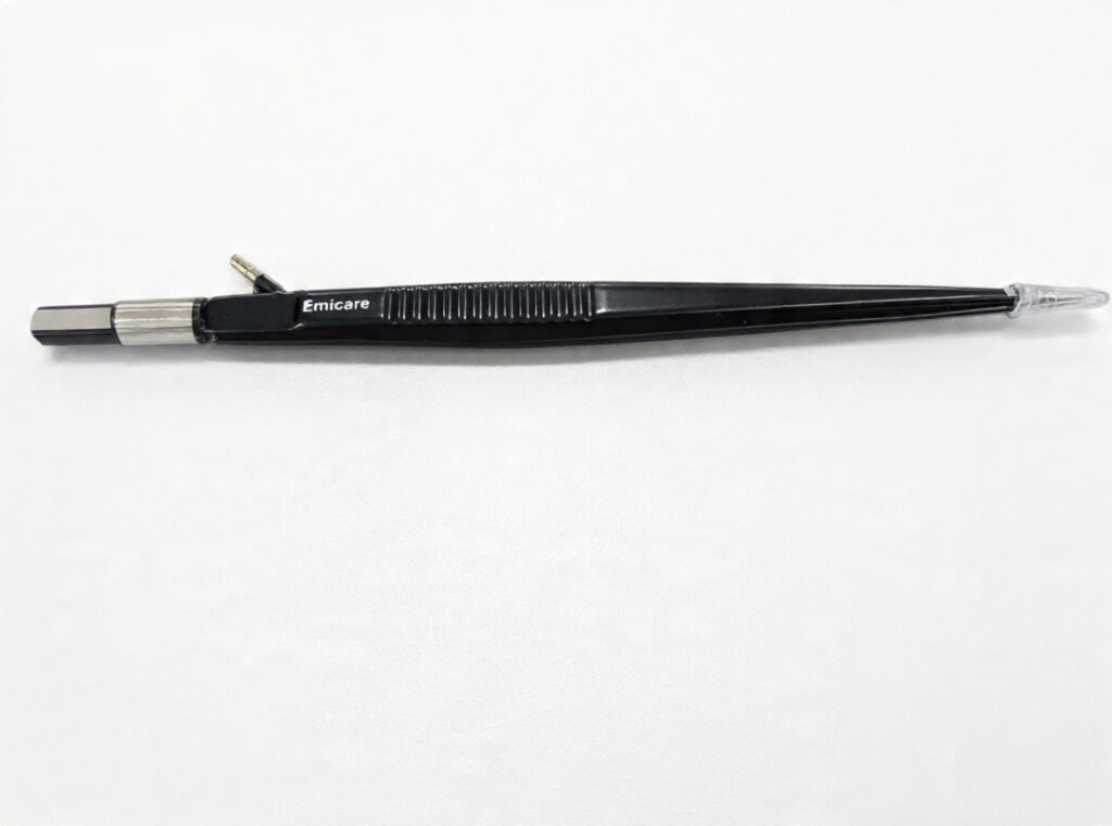 Pen-shaped precision instrument labeled 'Emicare' on a white background, with a metal tip on the left and a clear cap on the right.