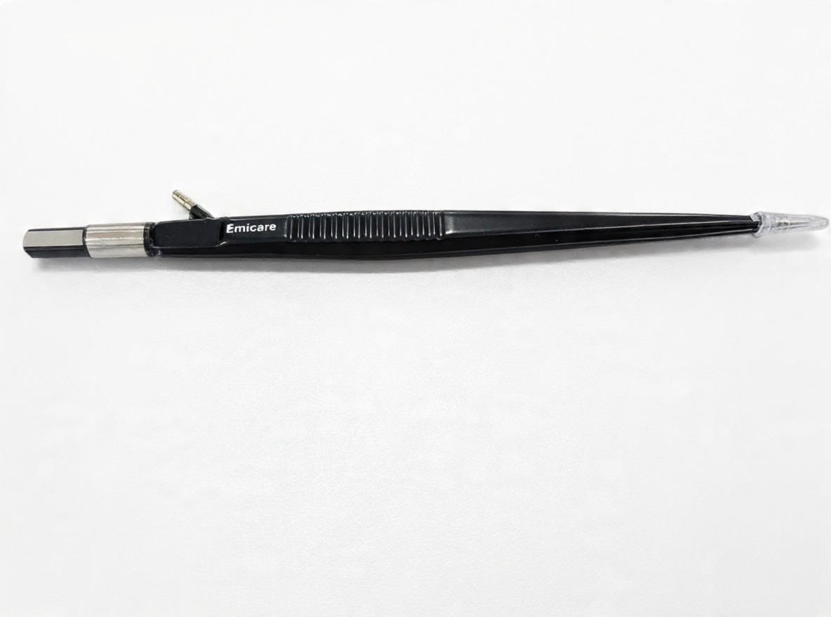 Pen-shaped precision instrument labeled 'Emicare' on a white background, with a metal tip on the left and a clear cap on the right.
